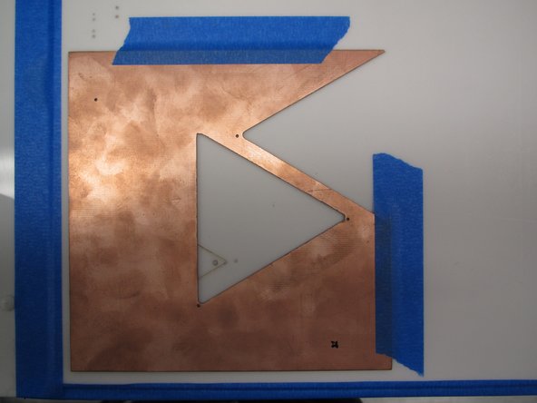 In order to use the mill camera for fiducial alignment, it must be calibrated before each  milling job.  Find a sacrificial piece of copper clad in the drawer below the mill.  Use a piece that has already had several boards cut from it.