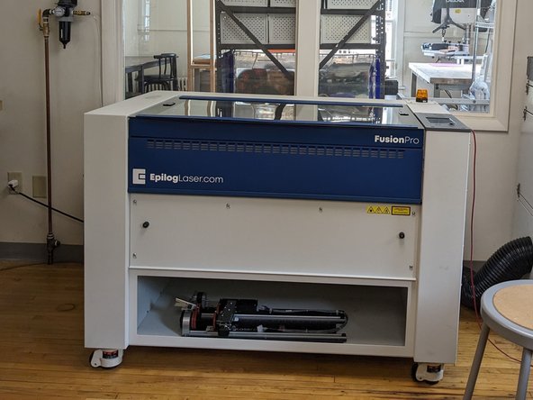 Open the lid of the laser cutter and place your material so it is lined up with the top left corner of the laser cutter bed (you can place it elsewhere on the bed if need be (see next step).