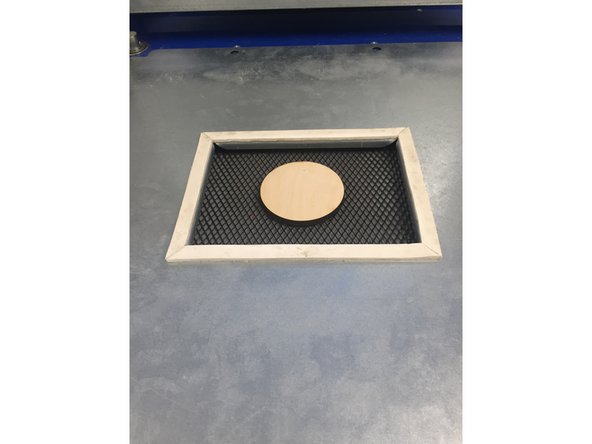 Place your object in the center of the bottom frame while the bed is still raised.