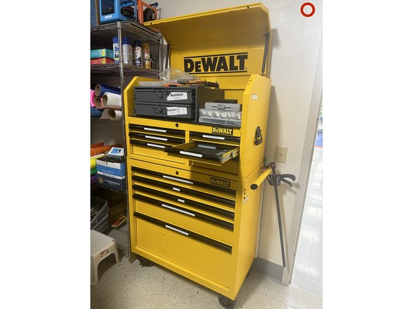 Go into the storage closet and grab the calipers located in the yellow DeWalt storage cabinet (calipers located in the second drawer on the right side- shown in pictures 1 and 2).
