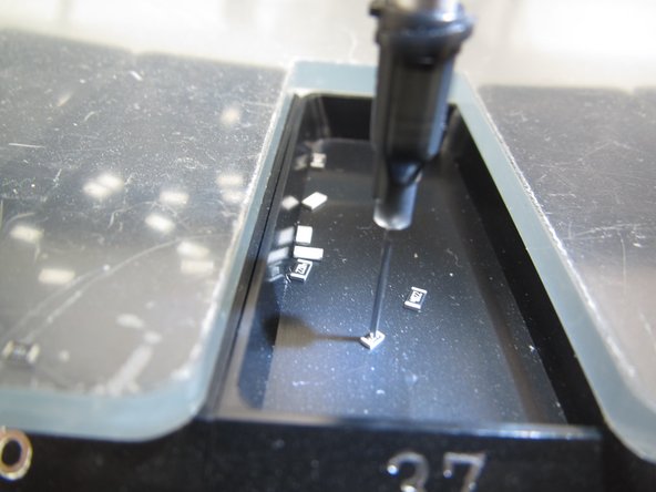 Use the placement knob to move the tip over the center of the first component you want to place.  Pull down on the placement knob until the tip just touches the center of your first component, in this case a resistor.