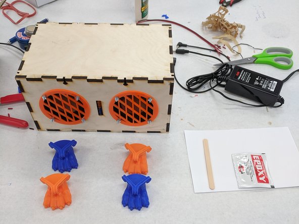 (29) Choose  four 3D printed feet from the supply provided.  Use whimsy or reserved caution at your discretion when choosing feet.