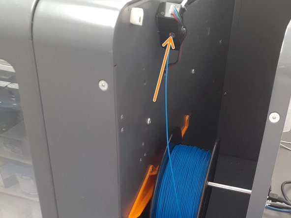 Create a slight inward pressure on the filament until the extruder grabs the end of the filament, pulling it in.