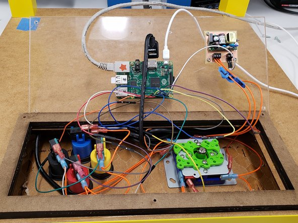 Unscrew the back panel of the gaming table. Unplug the HDMI table