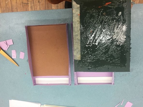 Paste the cardboard pieces so the glue sticks to the front papers.