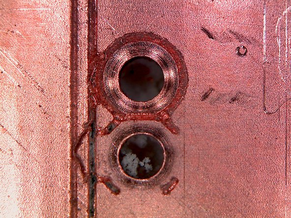 Portions of isolation channels are not entirely milled.  The channel should be uniformly dark, but instead there is residual copper remaining in the channel.  The tool did not cut deep enough.