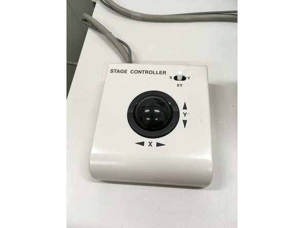 You can move around your sample using the trackball, the thumbnail and stage move button in the EM_Wizard control sidebar, or using the navigation tools in the image window.