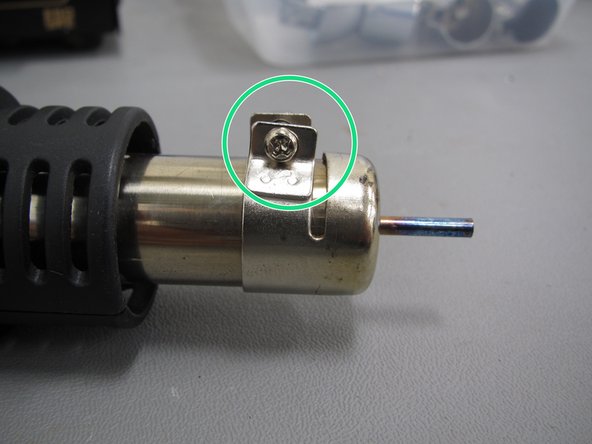Nozzles are located in a plastic container beside the rework tool.