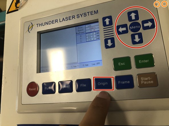 Set the origin using the red laser pointer dot. We want the origin at the left center of the work area, indicated by the red arrow in the first picture.