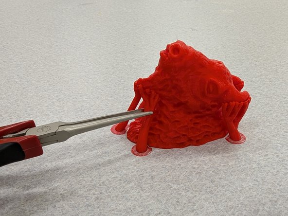 If your part had support material you should be able to remove it using your fingers.  Sometimes a pair of needlenose pliers are helpful as well.