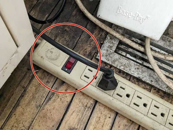 Next, turn on the red button located on the power strip on the floor where the exhaust system is located (to the right of the laser cutter).