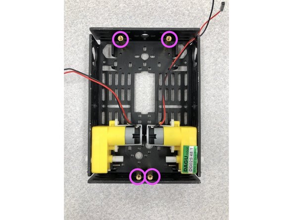 Using 2 wheels, 2 motors, and the caster ball we will now assemble the bottom portion of the cart. (Disregard the given pamphlet instructions while building the cart, we will use only it's part numbers as a reference)