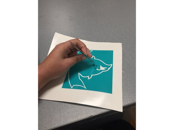 Peeling away the vinyl can be made easier by using a pair of tweezers located in the MakerSpace.