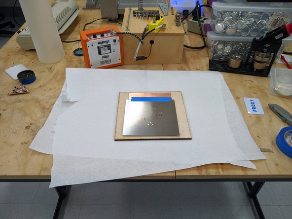 Place your stencil on top of the PCB in the jig.  Carefully align the stencil so that all of the holes line up properly.