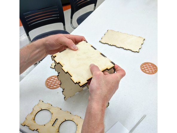 Paint the inside of the teeth on the bottom (longer) edge of the side piece.  Note that the T-slots should be on top, opposite the glue side.