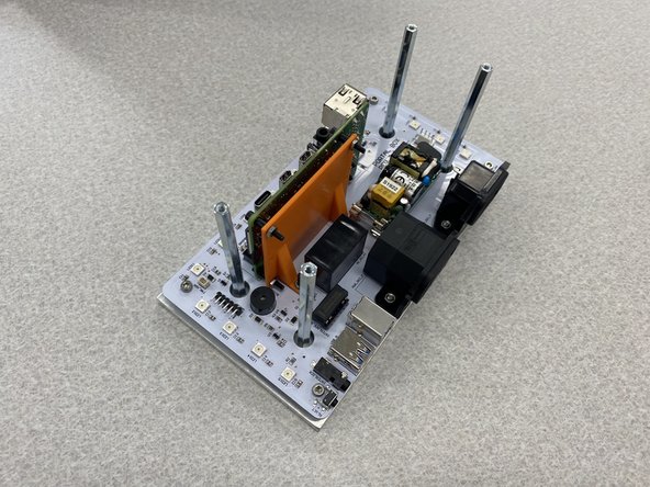 Slide the PCB over the long standoffs and onto the baseplate, making sure to line up the holes for the RPi with the M2.5 standoffs.  It should look like the third figure.