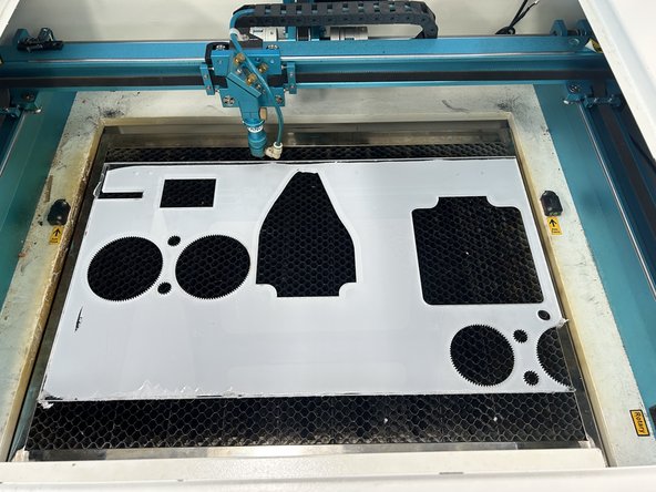 Grab some 6mm clear acrylic (or the pre-cut acrylic if you bought a base) and load it into the laser cutter. Peel the paper off the top of the acrylic.