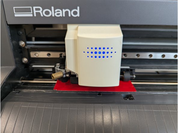 The vinyl cutter head will move to the left.  The vinyl will be pulled forward and backwards as the vinyl cutter measures the square.