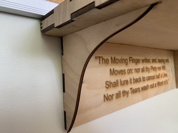 Unfortunately I didn't get any images of assembling the shelf.  The first step is to cut the appropriate length of the bright white LED strips and use their self-adhesive to stick them to the scored marks on the bottom part of the shelf.