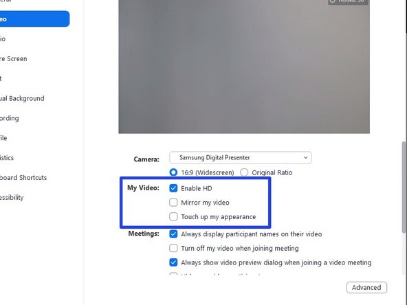 Within the video settings window, be sure to uncheck the box for Mirror my video.  You should also check the box for Enable HD.