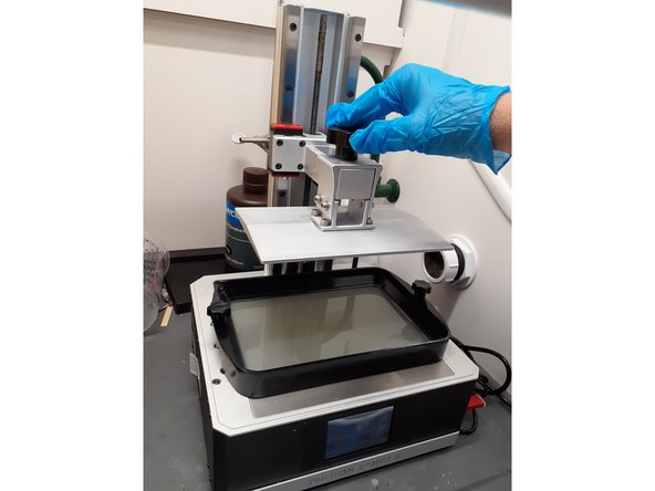 Open the Formlabs isopropyl alcohol wash station closest to the Formlabs resin printer