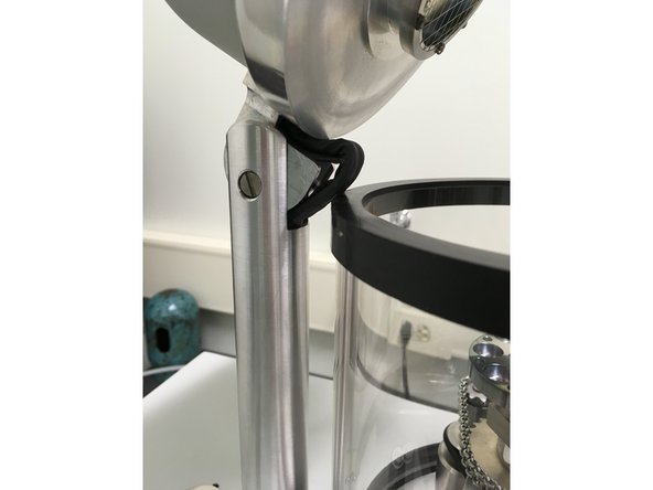 Carefully close the chamber. Be careful not to pinch the cable between the top and the wall of the chamber.