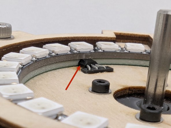 Place the Neopixel ring on top of the PCB assembly and look at the assembly from the side.  It is important to make sure that the pins on the Neopixel ring align properly with the connector on the PCB.