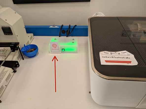 Begin by turning the Glowforge on by inserting the training card into the attached Portal box.