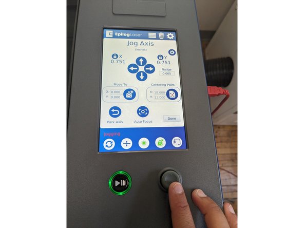 While looking at the touch screen on the laser cutter, click the 4th circle button in the bottom toolbar (the one that looks like a gaming control).