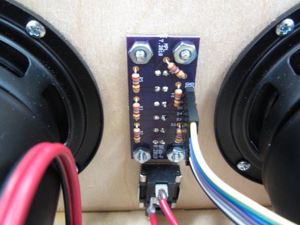 Next insert your PCB through the rectangular hole in the front panel of the enclosure.  Point the LEDs out of the hole.