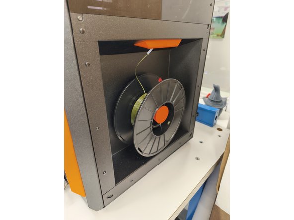 Confirm PLA filament is loaded in the printer.  Because two rolls can be mounted on top of the printer it is important to confirm which roll is currently fed into the extruder.  The sticker may also be on the side not visible from outside the printer.  Also note the manufacturer of the filament.  In the example here, Jessie PLA is loaded.