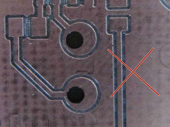 Drill holes should be nearly perfectly aligned within copper pads.  Holes should pass completely through the copper clad material.