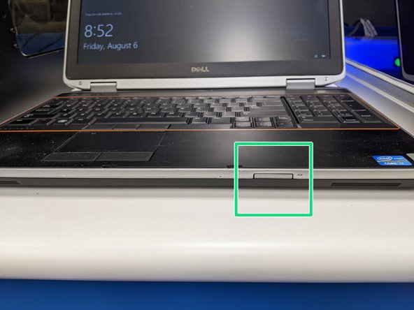 Insert the SD into the card reader located on the front of the laptop.