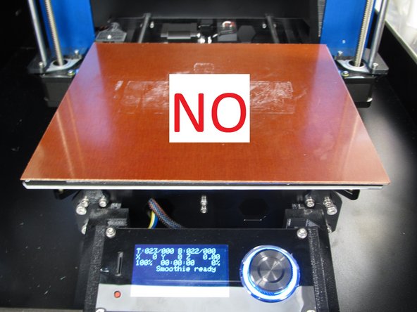 If the black print bed is not installed, get a technician to help you install it.