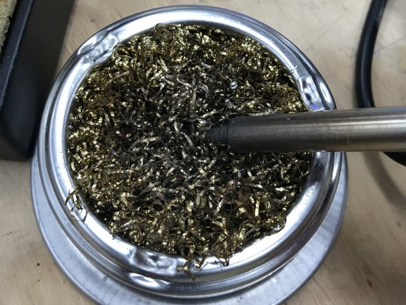 Dip the tip of the iron in the flux briefly and then remove.  It should hiss and melt while flux is applied.