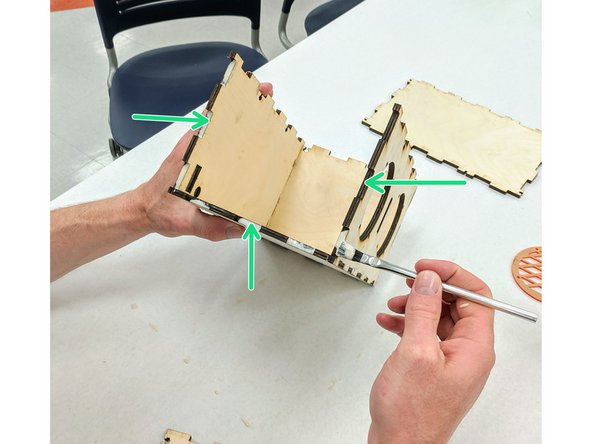 (5)Orient the box so that the open side is facing you.  Apply glue to the inside of the teeth on the bottom and two side edges.