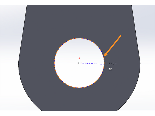 Anchor your circle in the center of the existing circle then move your mouse out from the center.  If you hover near the edge of the existing center circle SolidWorks should snap to this circle and show you a dotted orange preview circle.  Click your mouse to create this circle.  It should match the radius of the existing circle, 2.1 mm.