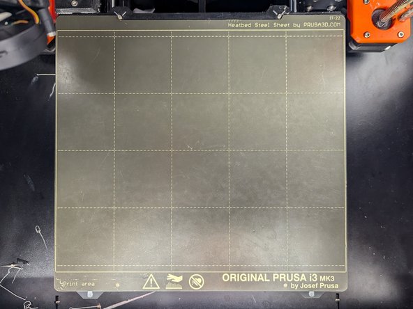Once you have removed your print and all remaining filament from the print surface you should return the print surface to the printer.