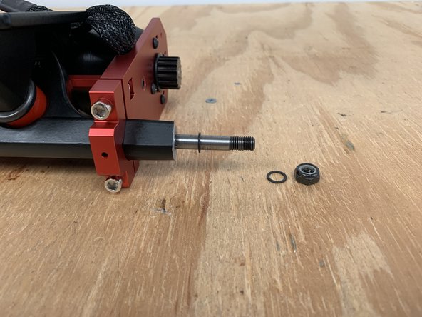 Use the T Tool to remove the locknut and 1x washer from the truck