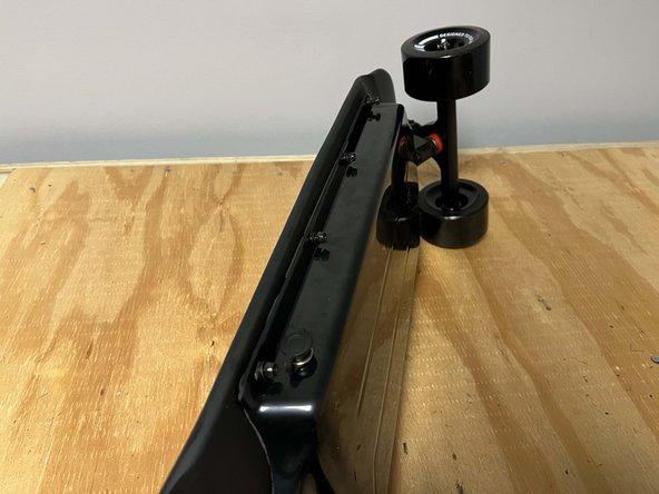 Place an enclosure bolt through the deck and into each hole in the enclosure