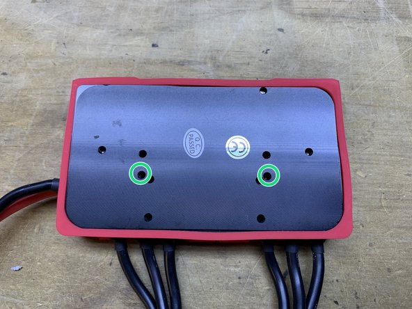 You will now need to secure the heatsink to the Xenith. You will use the two holes circled in green