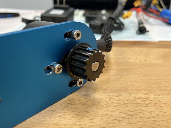 Slide the motor pulley onto the motor shaft, make sure it is flush with the end of the shaft (and not pushed all the way in).