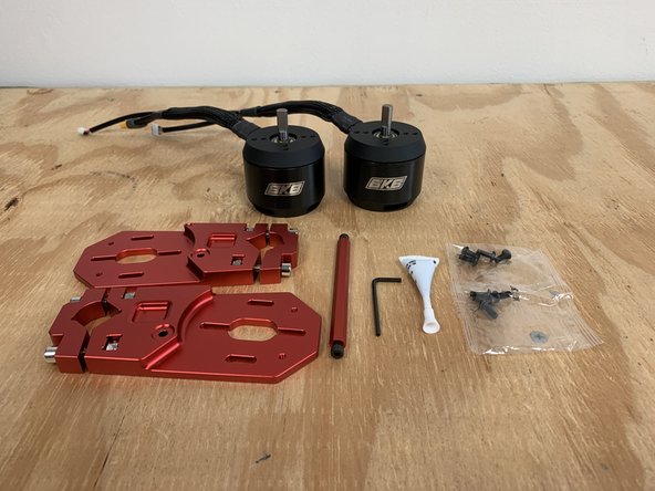 Gather the allen wrench, motors, motor mounts, cross bar, Loctite, and motor hardware.