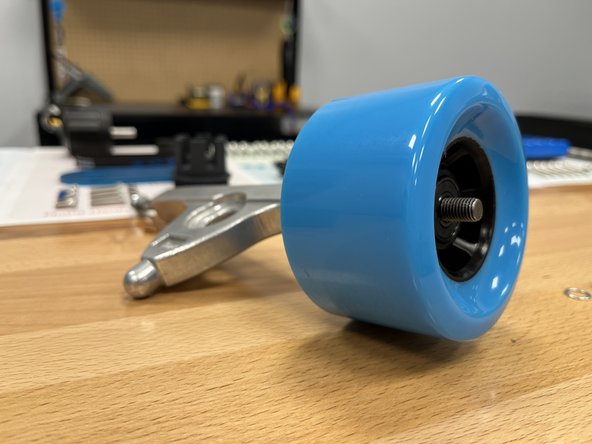 Place one silver spacer back onto the hanger (you removed them earlier)