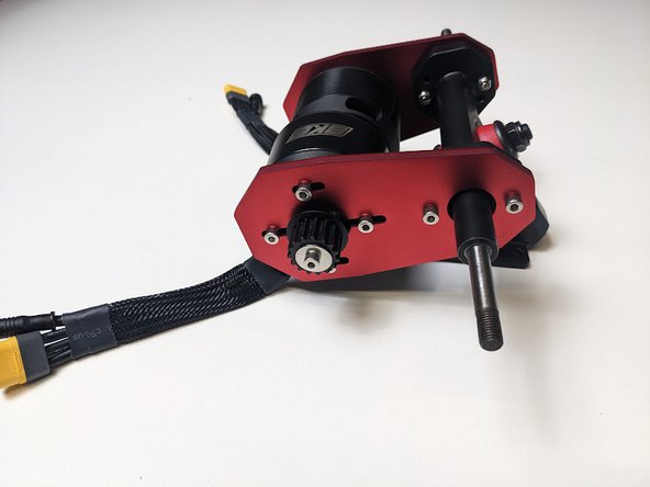 Once you have the motor mounts properly aligned, use your remaining long motor hardware and locknut to secure and mount.