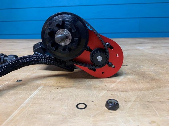 Place a belt around the motor and wheel pulley as shown