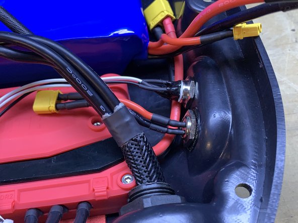 The switch and charge port have now swapped positions