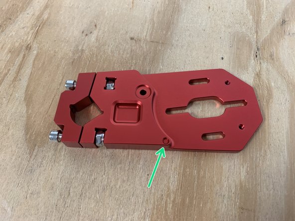 One motor mount has a dot cut out on each side. This needs to have the left motor (marked with an 'O' sticker) attached to it