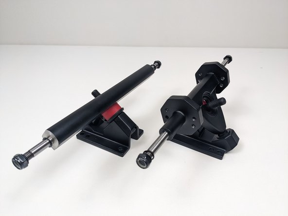 Remove one bushing and washer from each baseplate