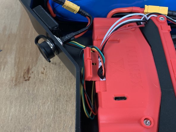 Plug the receiver into the UART port on the Xenith